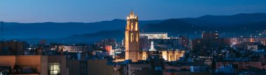 Skyline of the city Reus, Catalonia, Spain at night clipart