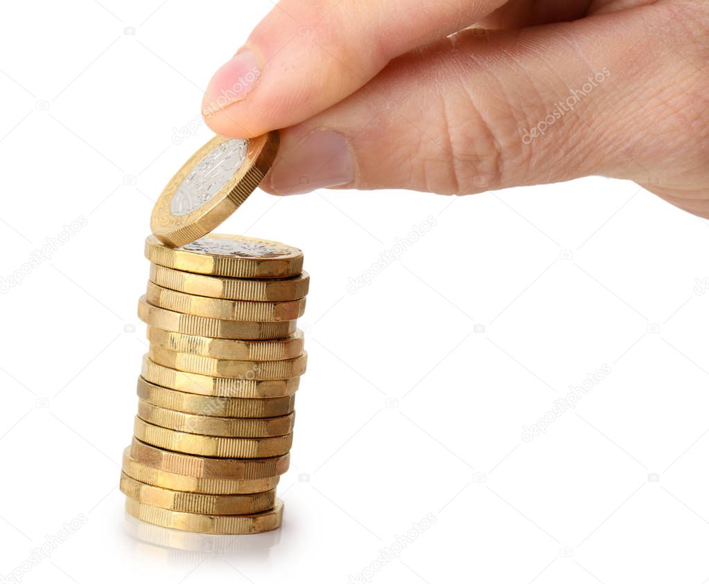 taking a coin from the stack, isolated on a white background