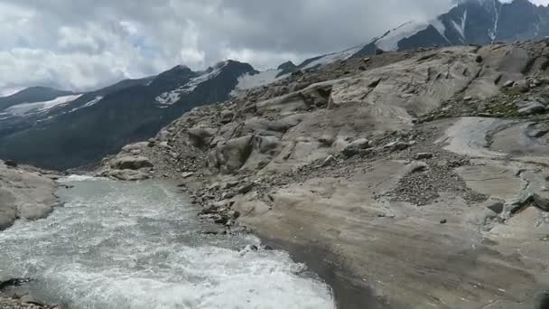 Hiker walking along the Gramsgrubenweg path at Grossglockner Mountain area. Austria. — Stock Video