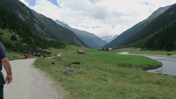 People visiting the Krimml Waterfalls, hiking along the footpath to the falls and into the achental valley. Austria. — Stock Video
