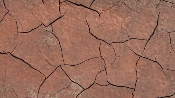 Camera pan view over cracked dirt. quarry background. — Stock Video