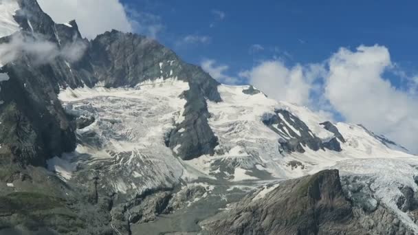 Hiker walking along the Gramsgrubenweg path at Grossglockner Mountain area. — Stock Video