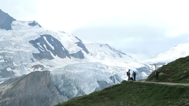 Hiker walking along the Gramsgrubenweg path at Grossglockner Mountain area. — Stock Video