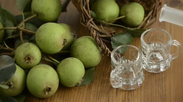 Pear liquor filled in two short glasses — Stock Video
