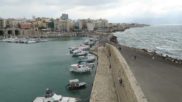 Cityscape of Iraklion, capital of Crete Isle (Greece). Sailing boats and ferries in harbor. — Stock Video