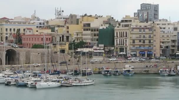 Cityscape of Iraklion, capital of Crete Isle (Greece). Sailing boats and ferries in harbor. — Stock Video