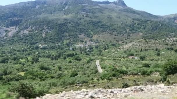 Road to mountain village Krasi on Crete /Greece. Driving along a road with olive trees aside — Stock Video