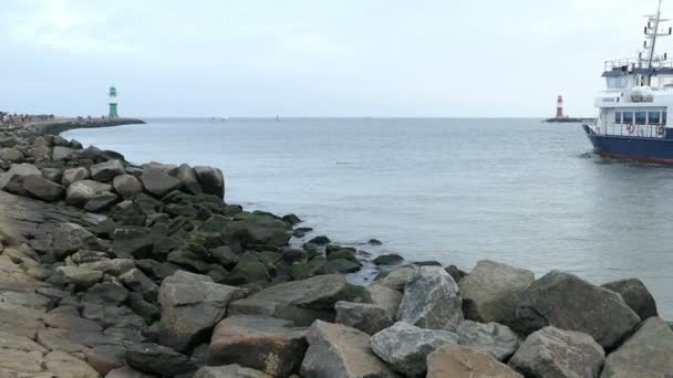 Industrial ships leaving the harbor of Rostock Warnemuende towards Baltic sea — Stock Video