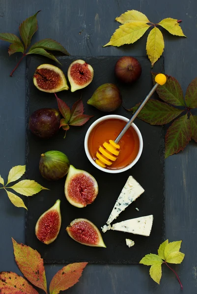 Fresh figs with cheese Dor Blue on gray board. — Stock Photo, Image