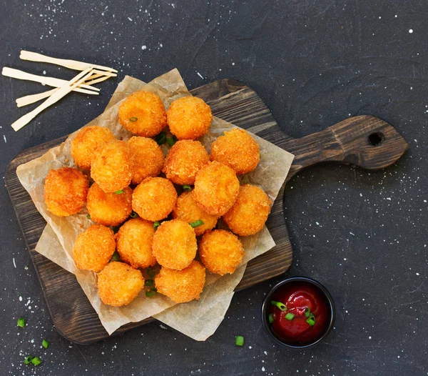 cheese balls with tomato sauce.