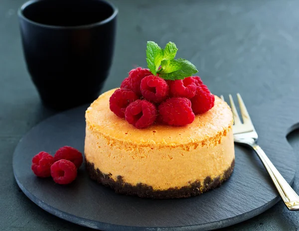 Pumpkin cheesecake with raspberries. Selective focus.