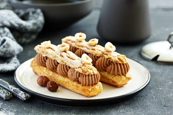 Homemade Eclair Chocolate Nuts Pastry — Stock Photo, Image