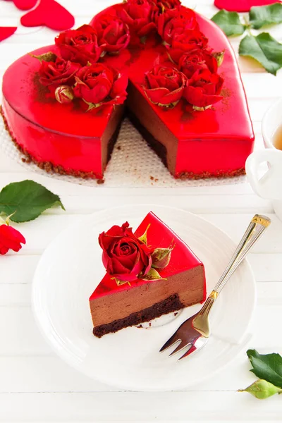 Chocolate and strawberry mousse cake in the shape of heart.