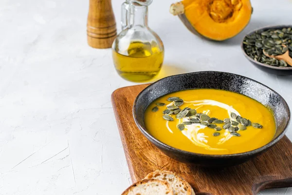 Pumpkin squash soup with seeds, olive oil