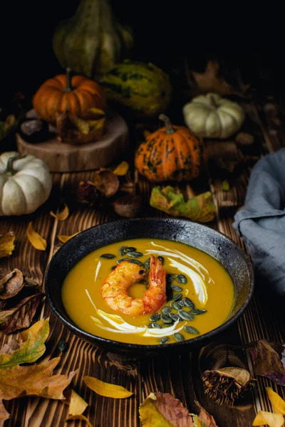 Pumpkin squash soup with seeds, olive oil