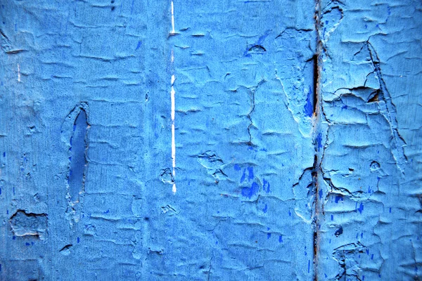 Dirty stripped      the blue wood door and rusty nail — Stock Photo, Image