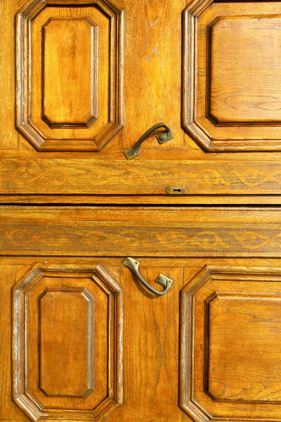 In the travedona monate  knocker a  door curch  closed wood ita — Stock Photo, Image