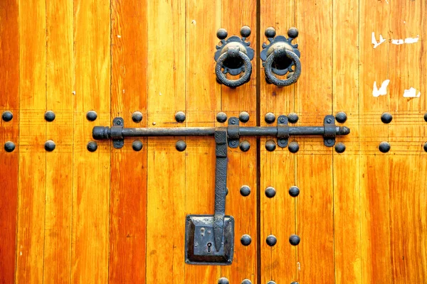 brown  morocco in africa   home and rusty safe padlock