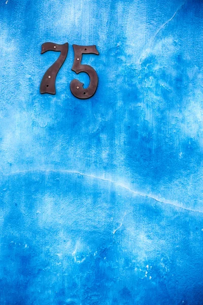 Numer w ścianie domu jak tekstura tło — Zdjęcie stockowe