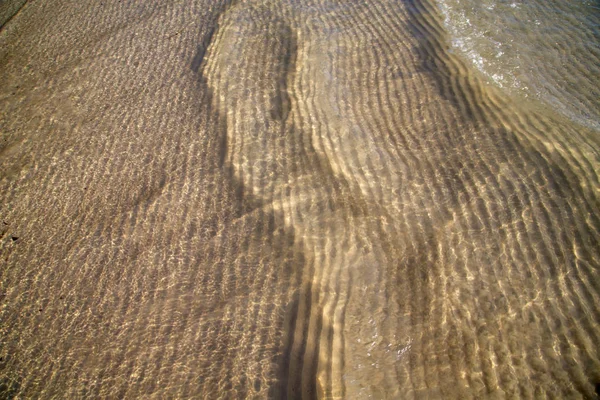 Písek a kho tao bay mokré v Jihočínském moři — Stock fotografie