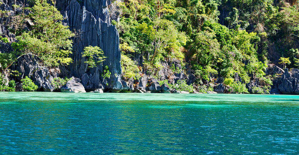 From a boat in philippines snake island near el nido palawan beautiful panorama coastline sea and rock
