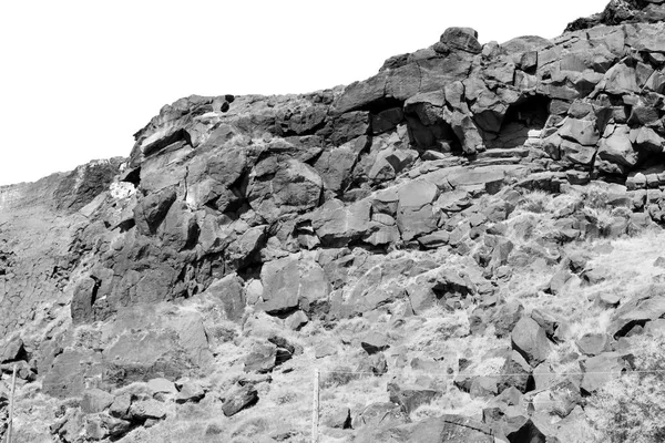 Rock alone in the sky santorini europe greece and dry bush — Stock Photo, Image