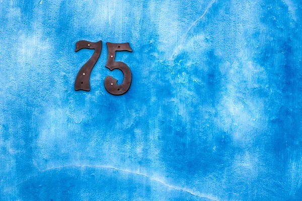 Zahl in einem Wandhaus wie Textur Hintergrund — Stockfoto