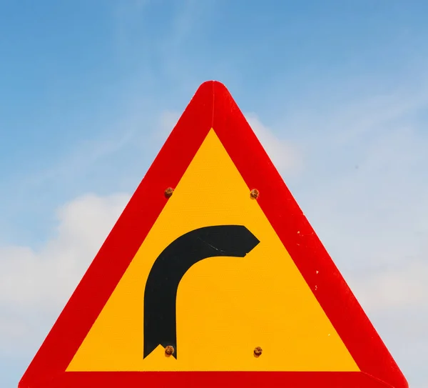 Road signal attention of the curve in the sky — Stock Photo, Image