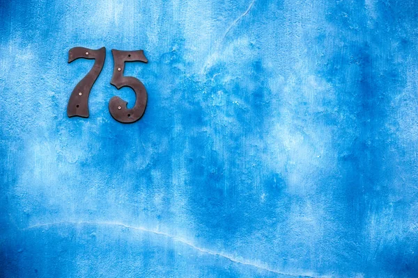 Zahl in einem Wandhaus wie Textur Hintergrund — Stockfoto