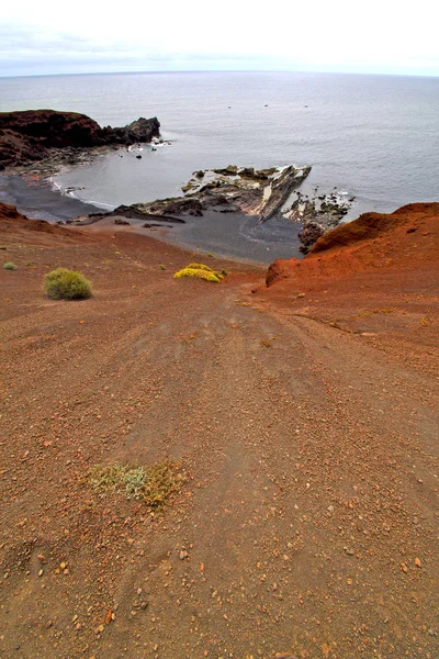 Hervideros brown rock  white coast down hill — Stock Photo, Image