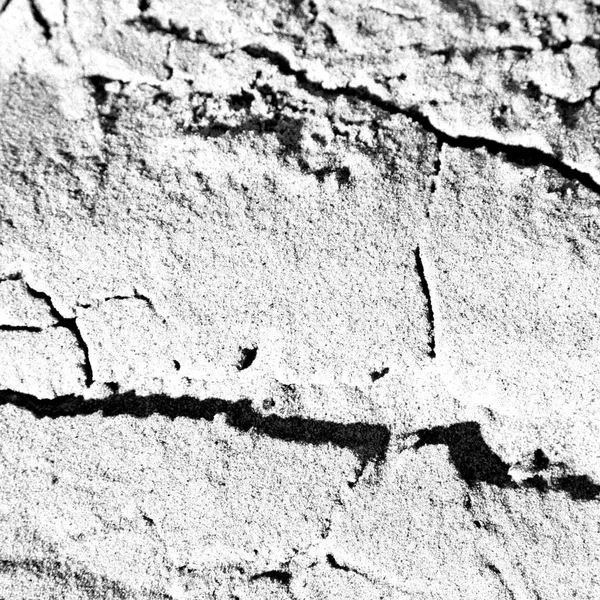 black and white shot of cracked sandy surface in oman, rub al khali