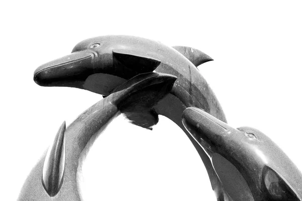Em oman velha estátua de golfinho — Fotografia de Stock