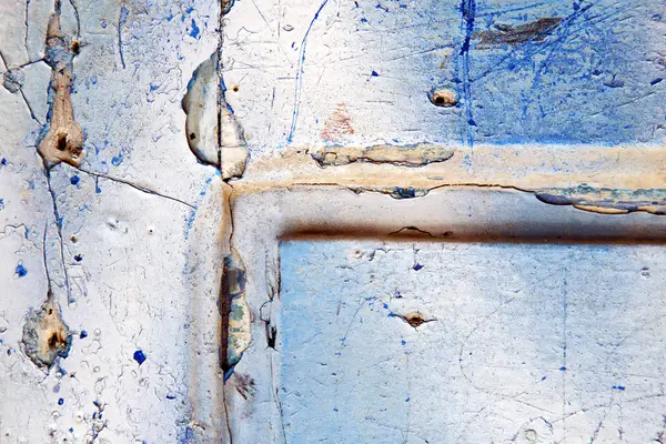 Stripped paint   blue wood door and rusty nail — Stock Photo, Image