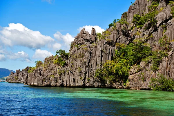 from a boat  in  philippines  snake island near el nido palawan beautiful panorama coastline sea and rock