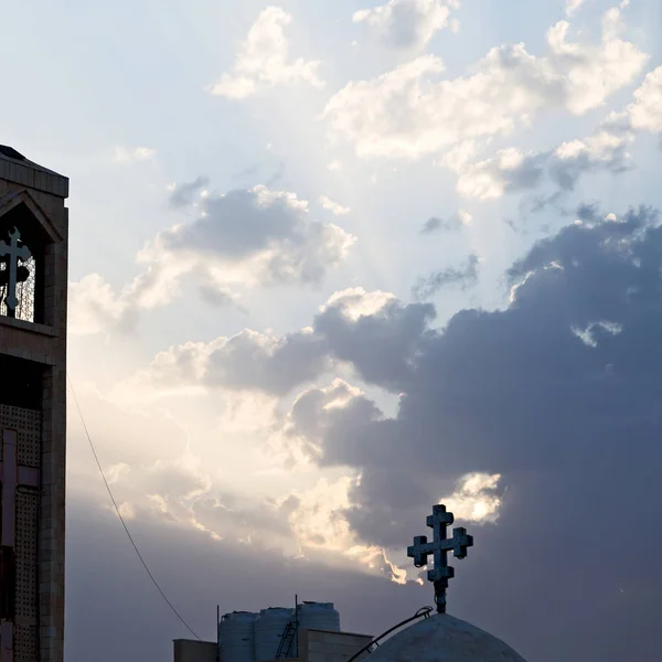 the chatolic church in the light of cloudy sunset