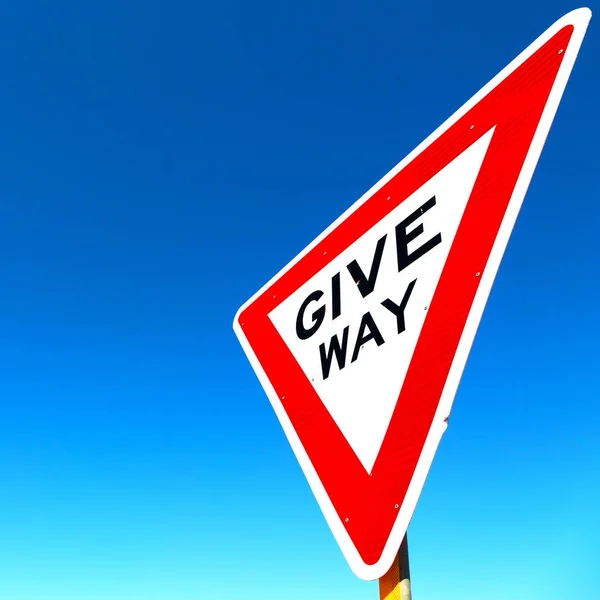 In  the road street signal of give way — Stock Photo, Image