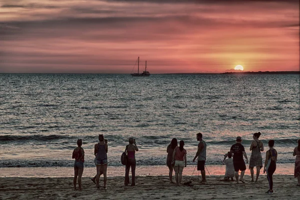 in  austalia  the bay of darwin  in the sunrise  and silhouette people