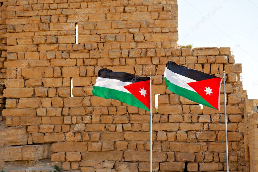 in jordan the national flag in the wind and sk