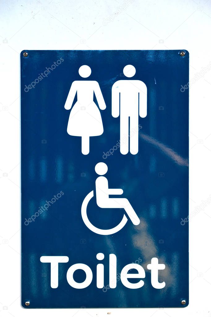 the door of the restroom and the sign for the direction