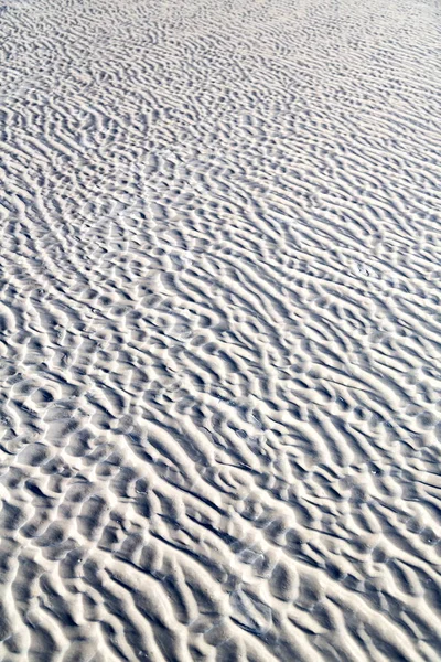 Und die abstrakte Textur des weißen Strandes — Stockfoto