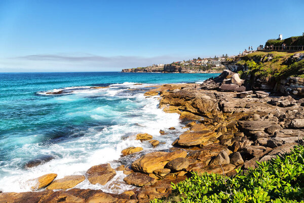 in  australia  sydney the bay the rock and the ocean near bondi beach