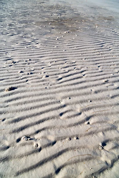 En de samenvatting van de textuur van het witte strand — Stockfoto