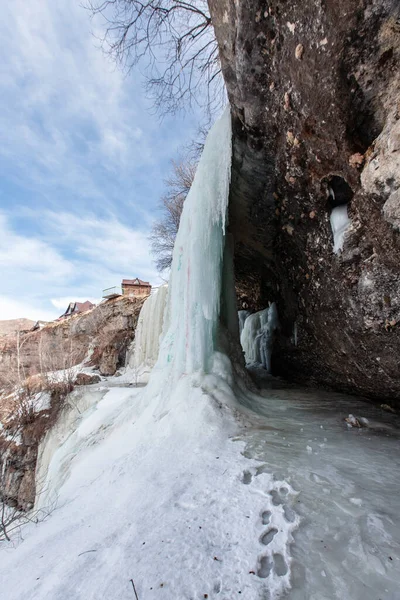 A large frozen waterfall. 3 cascading waterfall in Dagestan