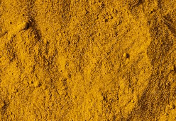 Deep-orange-yellow turmeric powder — Stock Photo, Image