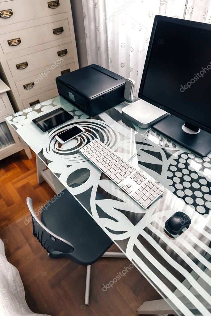 Workstation with table, chair, computer and printer