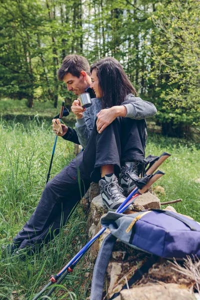 Couple pausing while doing trekking — Stock Photo, Image