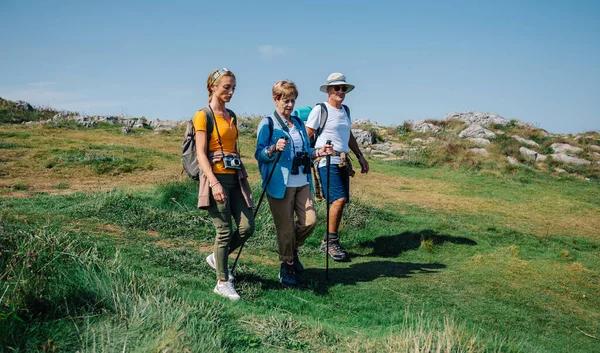 Family practicing trekking together outdoors — Stock Photo, Image