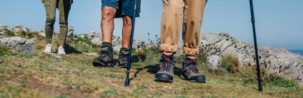 Three people practicing trekking outdoors — Stock Photo, Image