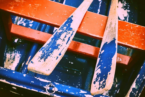 Weathered wood boat with paddles — Stock Photo, Image