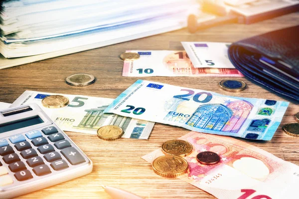 Euro banknotes and coins — Stock Photo, Image